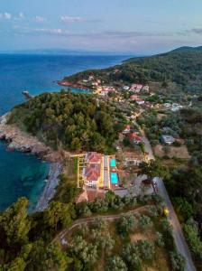 an aerial view of a small island in the ocean at Agrielia Studios Katigiorgis, Agios Georgios in Agios Georgios