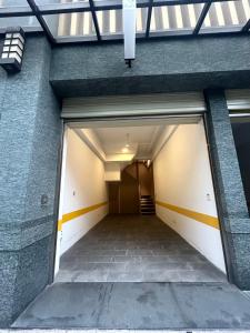 an open garage door of a building at Bentley Hotel in Zhongli