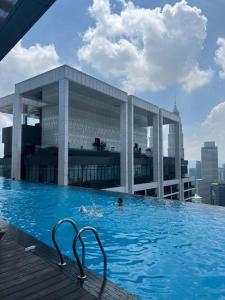 a swimming pool on top of a building at Vinson Suites at Platinum KLCC in Kuala Lumpur
