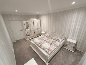 an overhead view of a bedroom with a bed and a cabinet at ApartmanyHurbanova1 in Bardejov