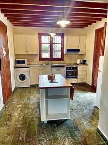 a kitchen with an island in the middle of it at The Olympians Villas in Polis Chrysochous