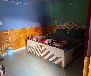 a bedroom with a large wooden bed in a room at Highland spirit 2 in Kasol