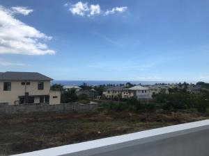 a view from the balcony of a house at AlexJ Residence in Flic-en-Flac