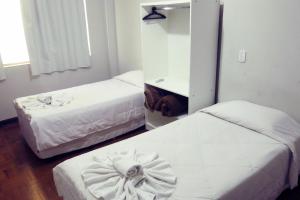 Cama o camas de una habitación en Hotel Jaú