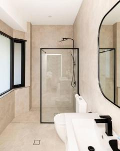 a bathroom with a shower and a white sink at Modern Home in the Heart of Bankstown in Bankstown