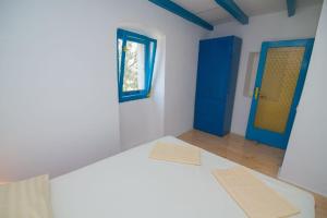 מיטה או מיטות בחדר ב-Ferienhaus mit Privatpool für 4 Personen ca 70 qm in Veli Lošinj, Kvarner Bucht Losinj