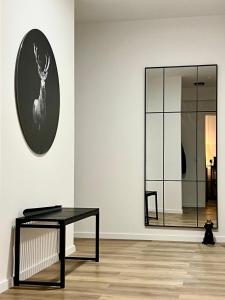 a room with a table and a picture of a deer on a wall at 2Br freeParking DUS Airp DUS Ess NTFLX in Wuppertal