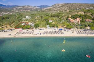 an aerial view of a beach with a group of people at Lampiris Beach Front Apartments in Potos
