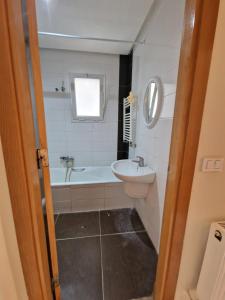 a bathroom with a sink and a bath tub at Tom II Expresse Médical in Tunis