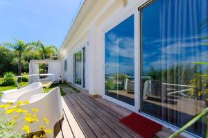 balcón con vistas al océano en Ferienwohnung für 4 Personen ca 45 qm in Taormina, Sizilien Ostküste von Sizilien - b57254, en Taormina