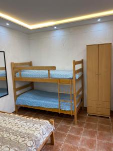 a room with two bunk beds and a bed at INO Apartments in Tivat