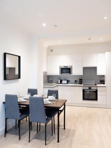 a kitchen with a dining room table and chairs at Apartment in Brighton in Brighton & Hove