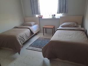 Voodi või voodid majutusasutuse Spacious Residential Apartment toas