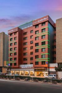 a rendering of a hotel building at Novotel Suites Riyadh Olaya in Riyadh