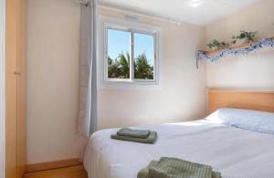 Ένα ή περισσότερα κρεβάτια σε δωμάτιο στο Natural casita El Palmar Playa-Zoco 300m