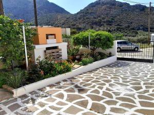 a house with a patio with a view of a mountain at Katerina's House in Sitia