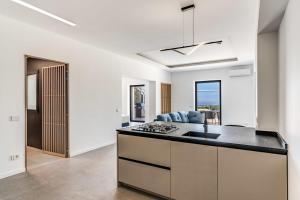 a kitchen with a stove and a counter top at Suite San Montano by Feeling Italy in Massa Lubrense