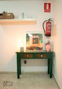 a green desk with a picture on it at ACUBILLO in Palas de Rei