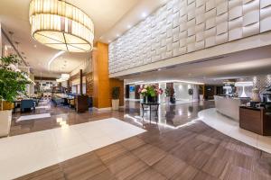 a lobby of a hotel with a reception area at Novotel Suites Riyadh Olaya in Riyadh +82 photos