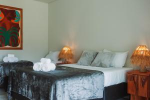 Postel nebo postele na pokoji v ubytování Luau Hotel + 37 fotografií
