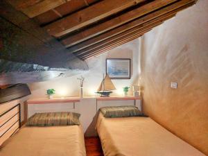 Ένα ή περισσότερα κρεβάτια σε δωμάτιο στο Casa Stellino 33 nel cuore di Portoferraio