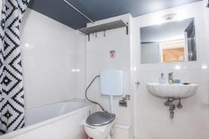 a bathroom with a toilet and a sink at Amazing apartment at Exarcheia in Athens