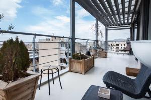 a balcony with a view of a city at Penthouse with 360 View of Athens and Private Gym in Athens