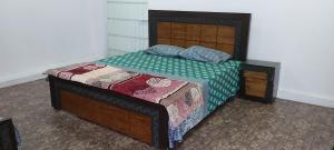 A bed or beds in a room at Kashmir Cottage Muzaffarabad