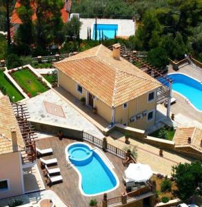 an aerial view of a house with a swimming pool at Dreamy Villa Jasmine with Private Pool In Skiathos in Troulos