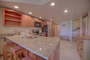 a kitchen with a sink and a counter top at One BDR Ski in Ski Out Condo in Breckenridge