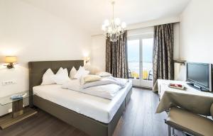 Postel nebo postele na pokoji v ubytování Hotel Pension Verdorfer + 37 fotografií