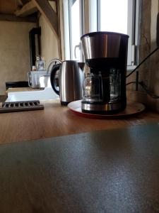 a coffee maker sitting on a counter in a kitchen at Gîtes Normands de charme les châtaigniers in Bretteville-du-Grand Caux