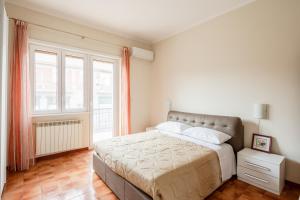 a bedroom with a large bed and a window at Casa Brando in Santa Maria delle Mole