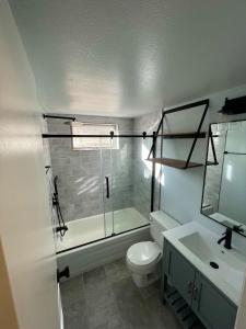 a bathroom with a shower and a toilet and a sink at Lovely 2 BDR Condo Close to Skiing and Main St in Breckenridge