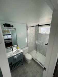 a bathroom with a shower and a toilet and a sink at Lovely 2 BDR Condo Close to Skiing and Main St in Breckenridge