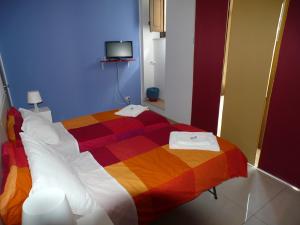 Postel nebo postele na pokoji v ubytování Sicily Rooms Enna
