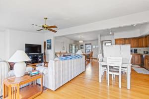 a living room with a couch and a table at Homey 3BR Near Lake Dillon with Mountain Views in Dillon