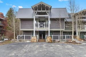 a large house with a gambrel roof at Cozy 2 BR Condo in Town Walk to Main St Skiing in Breckenridge