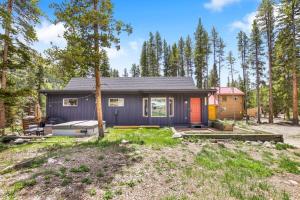 a purple tiny house in the woods at Stunning 4 BR Home Mountain Views Tranquil Setting in Breckenridge