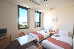Postel nebo postele na pokoji v ubytování ArC LIFESTYLE SPACE & HOTEL + 13 fotografií