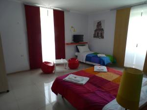 Postel nebo postele na pokoji v ubytování Sicily Rooms Enna