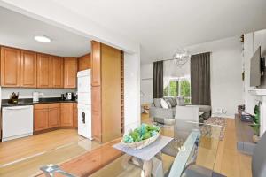 a kitchen and a living room with a table at Stunning 3BR central to Breck Keystone Copper in Silverthorne