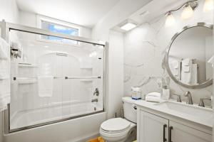 a bathroom with a shower and a toilet and a sink at Stunning 3BR central to Breck Keystone Copper in Silverthorne +22 photos
