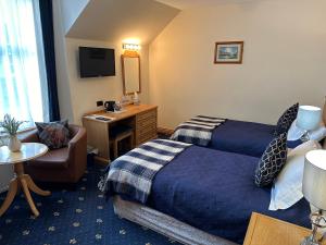 Postel nebo postele na pokoji v ubytování The Glen Hotel Newtonmore