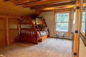 a bedroom with a bunk bed and a window at Tranquil 3BR Home Access To Trails and Mtn Views in Blue River