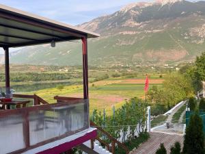 a balcony of a house with a view of a mountain at SuperPanorama GuestHouse in Kukës