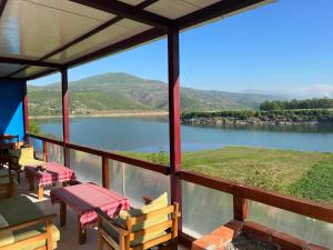 a view of a river from the porch of a house at SuperPanorama GuestHouse in Kukës