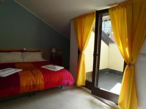 Postel nebo postele na pokoji v ubytování Sicily Rooms Enna