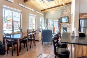 a dining room with a table and chairs at 2BR Riverside Chalet Near Trails in Breckenridge