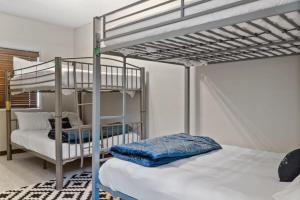 a bedroom with two bunk beds and a couch at 2BR Blue River Home withStunning Views in Blue River